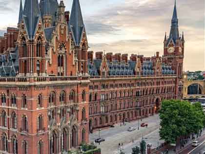 ornate redbrick Victorian building in London with tall spires